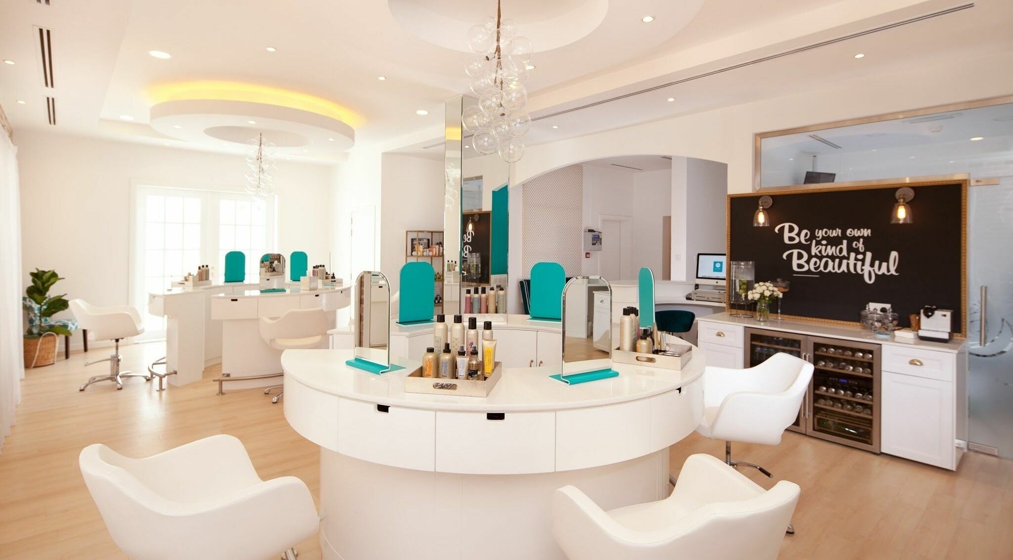 Modern interior of Be Bar Blow Dry Bar in Dubai, AE featuring stylish seating and beauty stations.