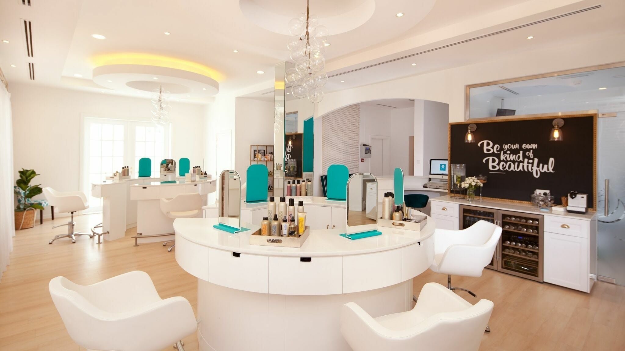 Modern interior of Be Bar Blow Dry Bar in Dubai, AE featuring stylish seating and beauty stations.