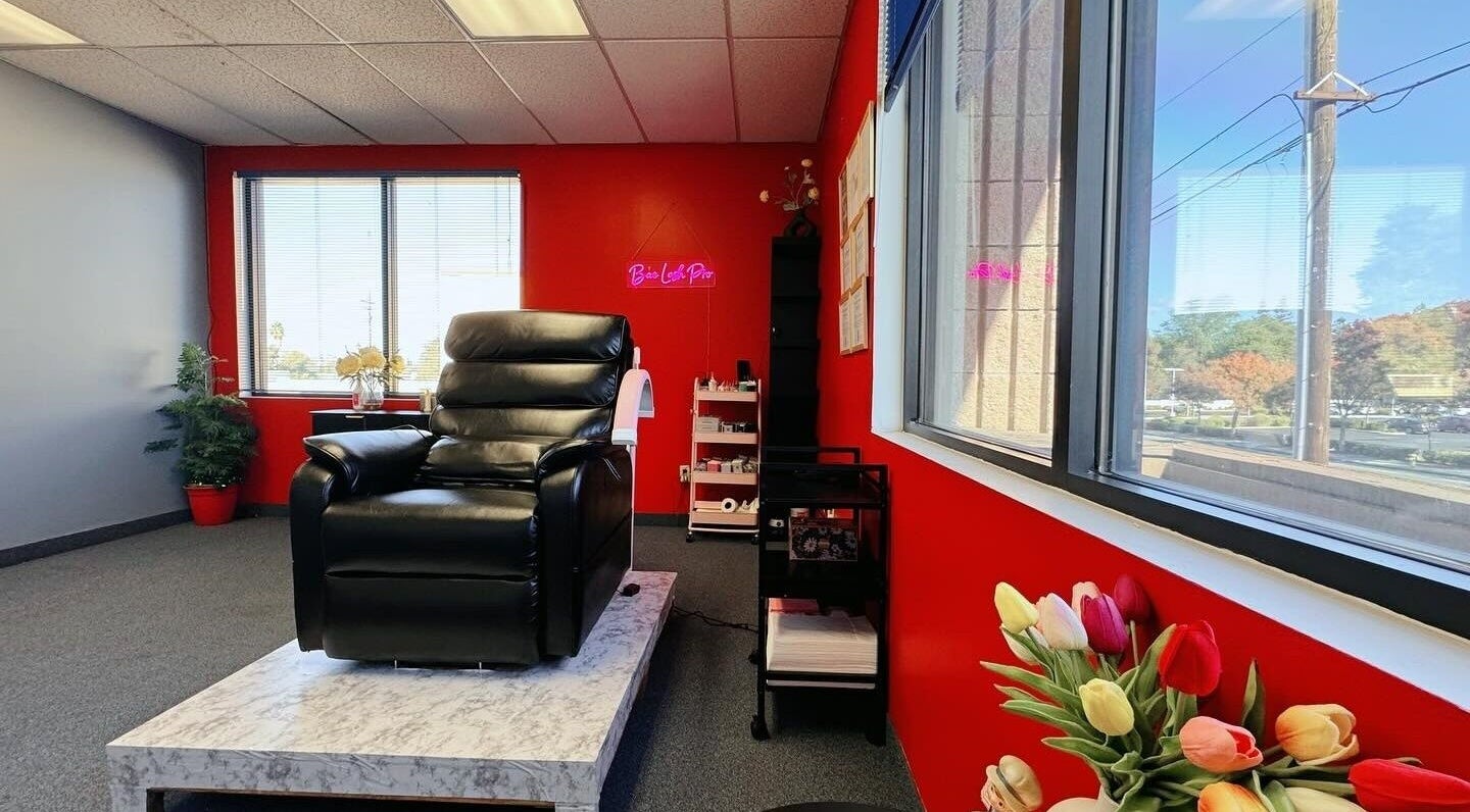 Luxurious beauty lounge at Bae Lash Pro, San Jose, California, US with black chair and vibrant decor.