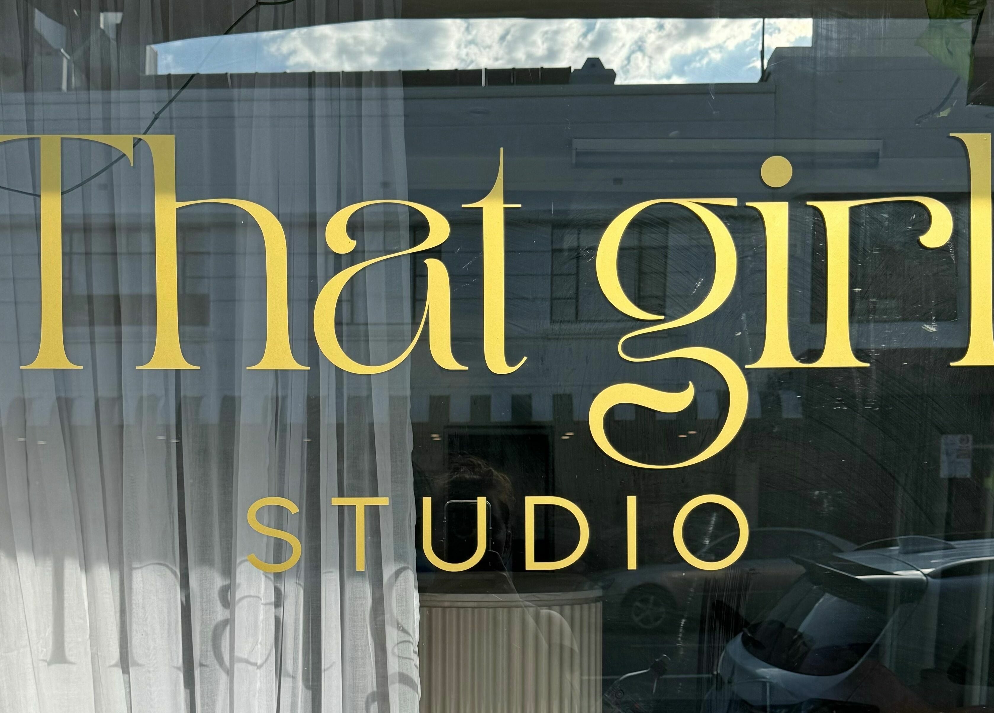 That Girl Studio sign in St Kilda, Melbourne, Victoria, AU, showcasing elegant design.
