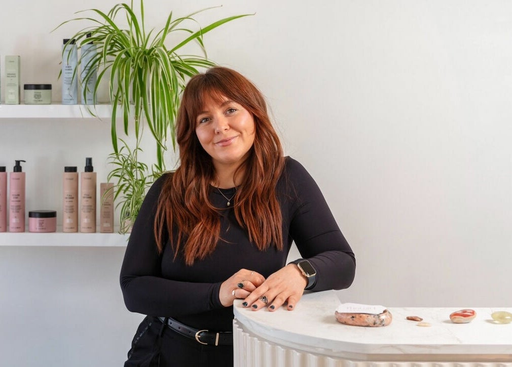 Friendly staff at That Girl Studio in St Kilda, Melbourne, with beauty products displayed.