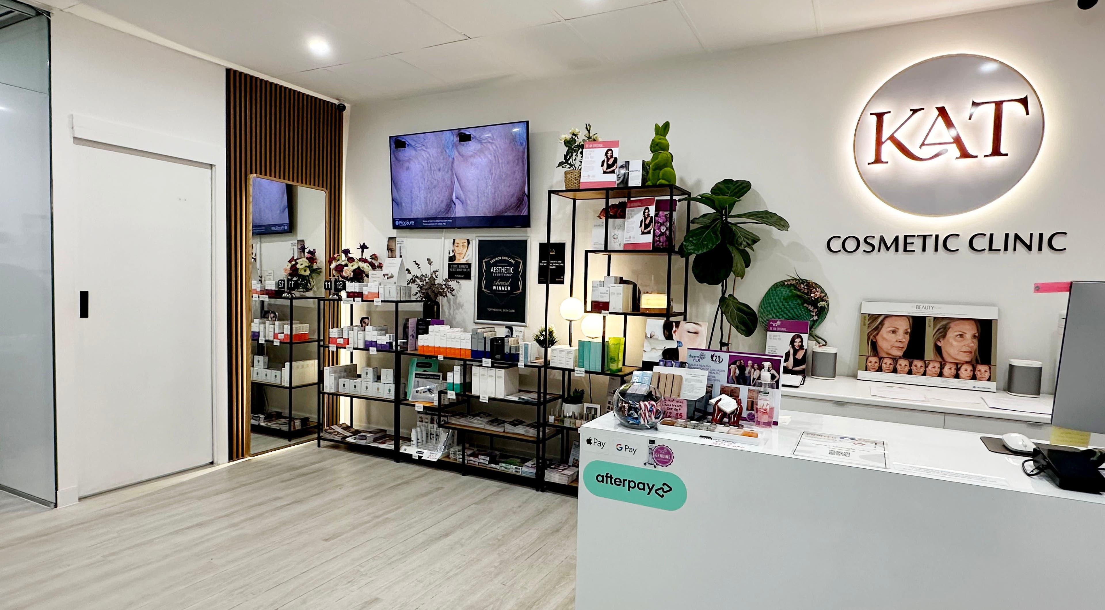 Modern reception area at KAT Cosmetic Clinic in Cabramatta, New South Wales, AU, featuring sleek design and product display.
