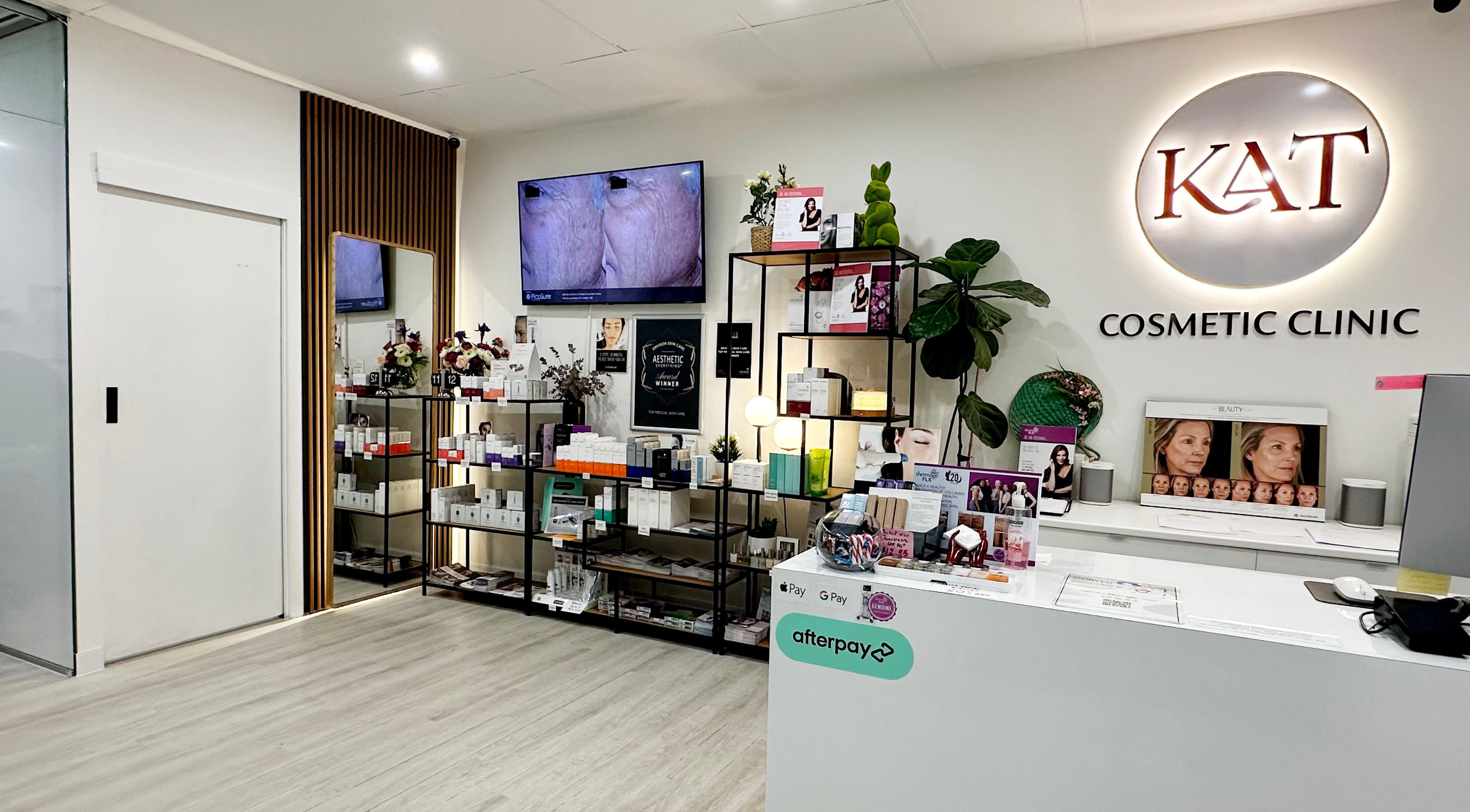 Modern reception area at KAT Cosmetic Clinic in Cabramatta, New South Wales, AU, featuring sleek design and product display.