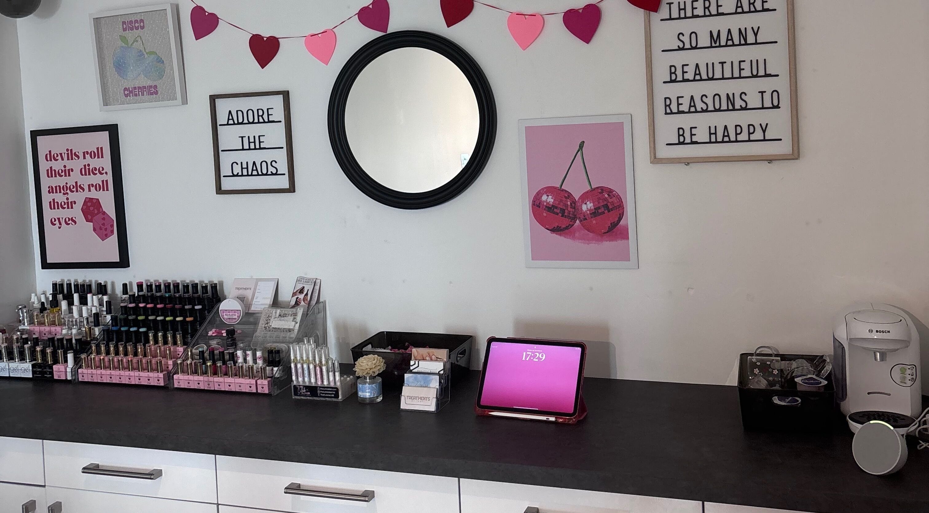 Contemporary beauty setup at Treatments by Teoni in Nuneaton, England, GB with decor and nail polishes.