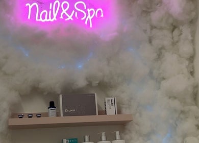 Neon Nail & Spa sign with cloud decor at Glowberry, Romford, England, GB, creating a serene ambiance.