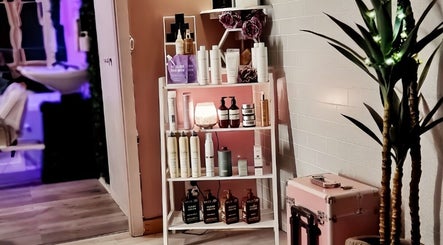 Stylish product shelf at Hue of Aura in Timaru, Canterbury, NZ, showcasing premium beauty and wellness items.