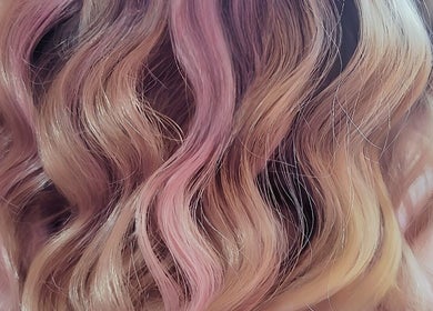 Close-up of vibrant pink and blonde wavy hair at Hue of Aura, Timaru, Canterbury, NZ.