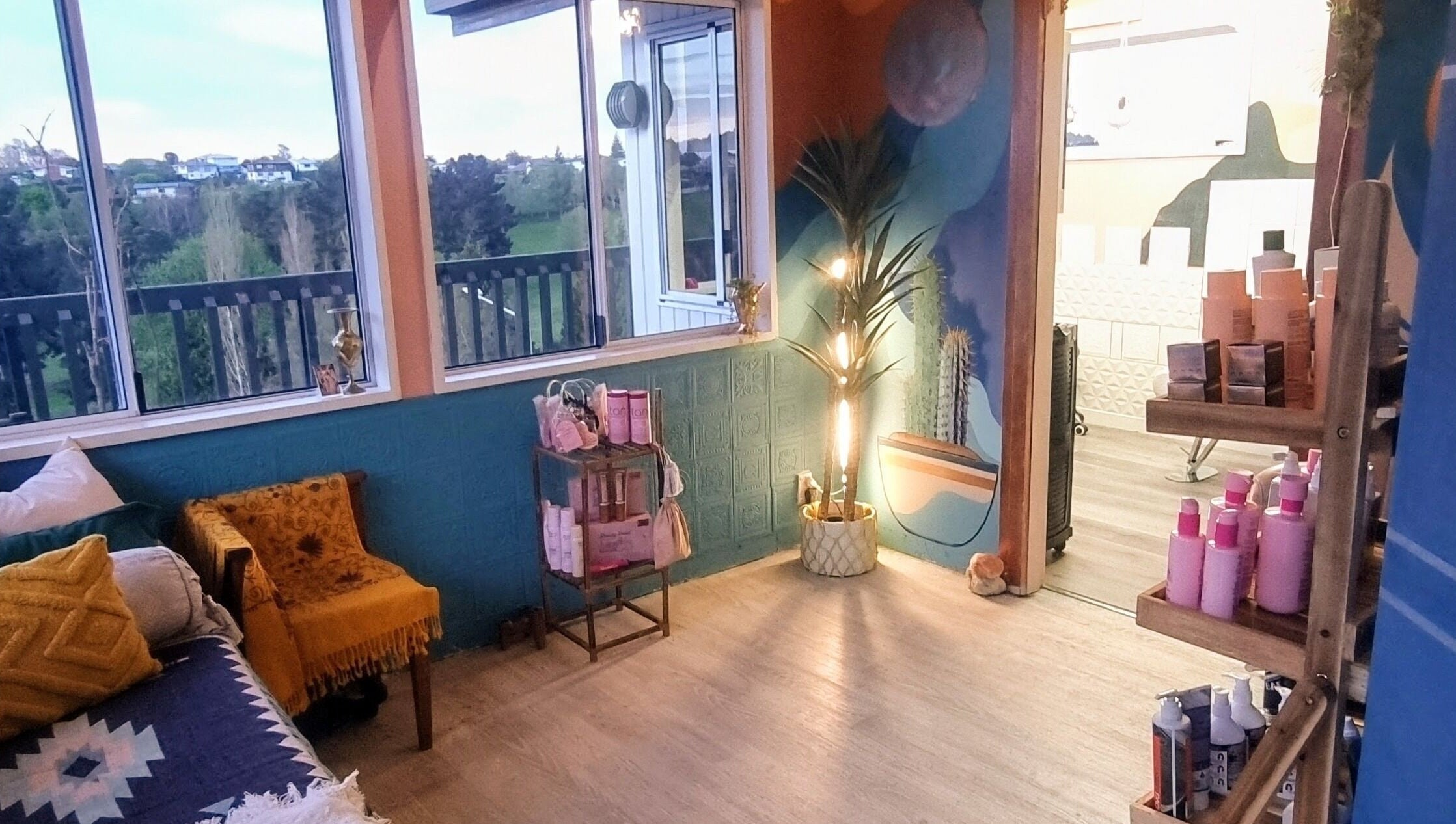 Relaxing wellness lounge at Hue of Aura, Timaru, Canterbury, NZ with plush seating and scenic views.