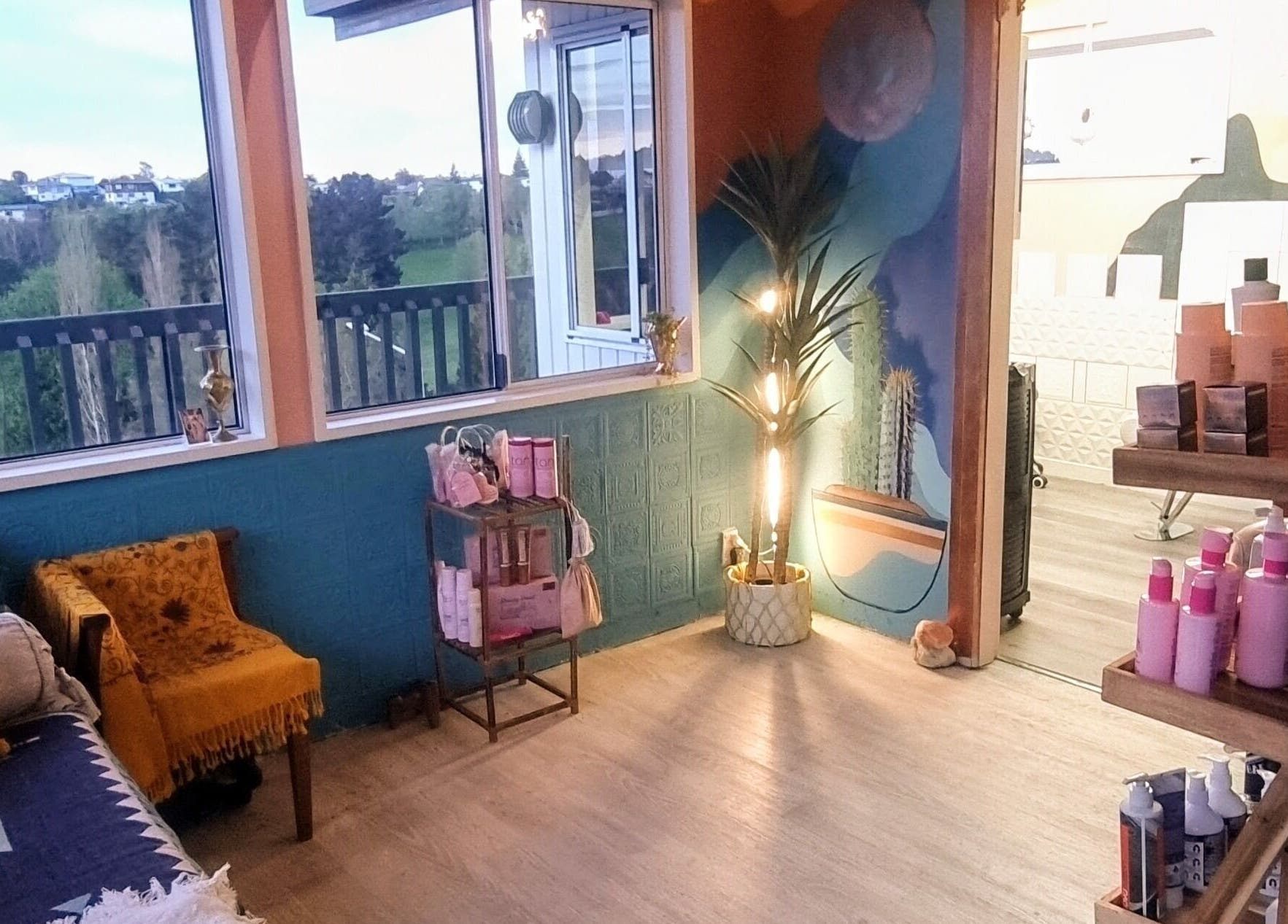 Relaxing wellness lounge at Hue of Aura, Timaru, Canterbury, NZ with plush seating and scenic views.