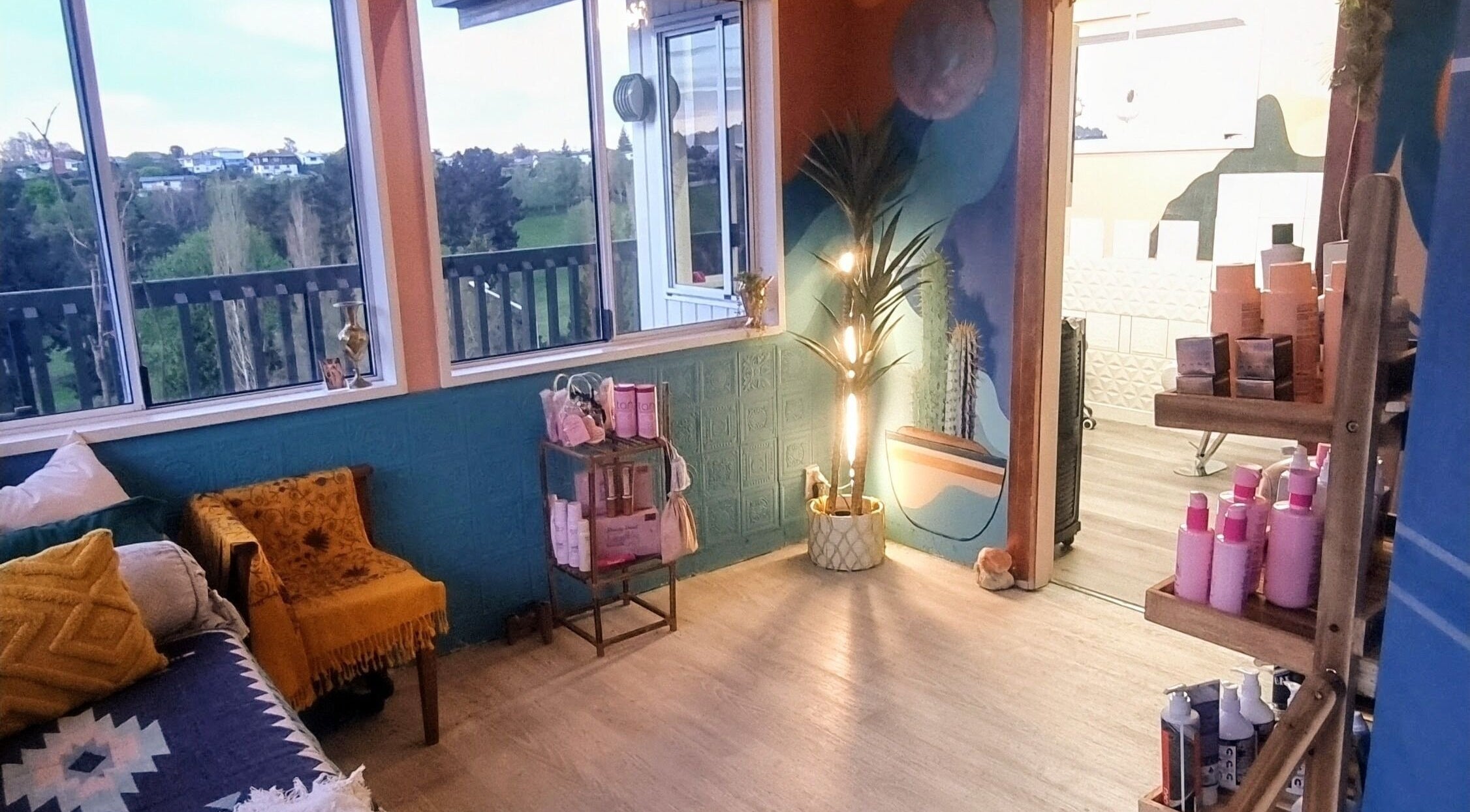 Relaxing wellness lounge at Hue of Aura, Timaru, Canterbury, NZ with plush seating and scenic views.