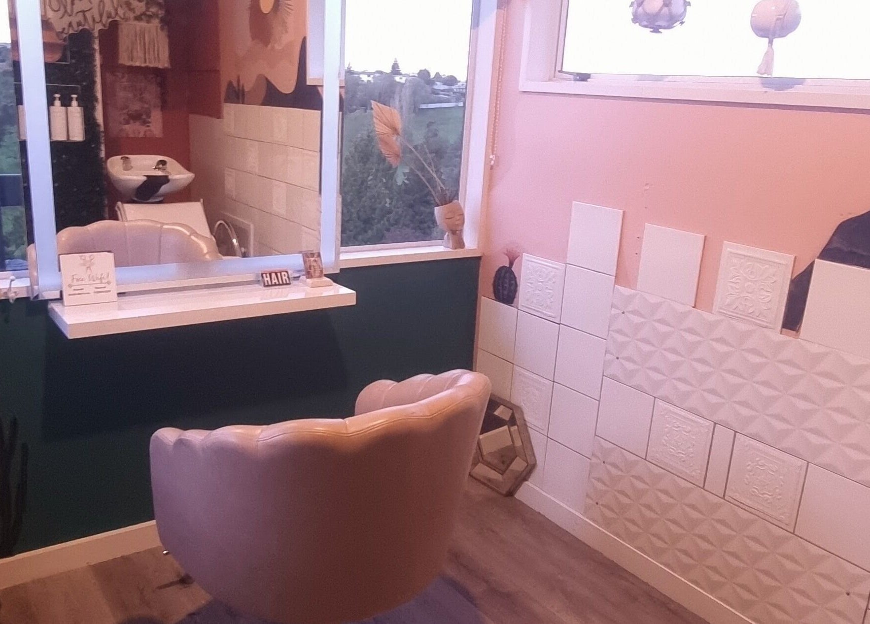 Stylish salon corner at Hue of Aura, Timaru, Canterbury, NZ with modern decor and scenic window view.