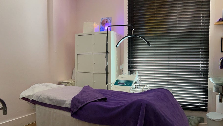 Serene treatment room at Pebble Beauty London, with a cozy bed and modern equipment in London, England, GB.