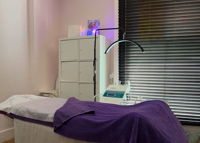 Serene treatment room at Pebble Beauty London, with a cozy bed and modern equipment in London, England, GB.