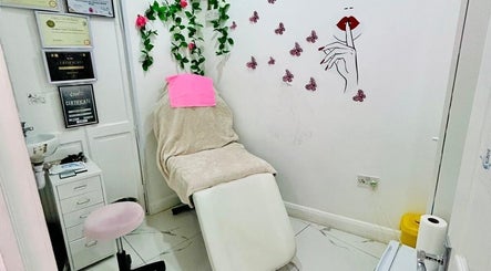 Relaxing treatment room at Beauty Works, London, England, GB with a cozy chair and soothing decor.