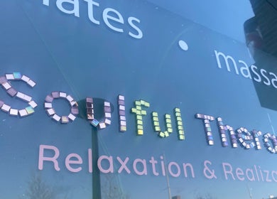 Reflective Soulful Therapy signage in Amsterdam, Noord-Holland, NL promoting relaxation services.