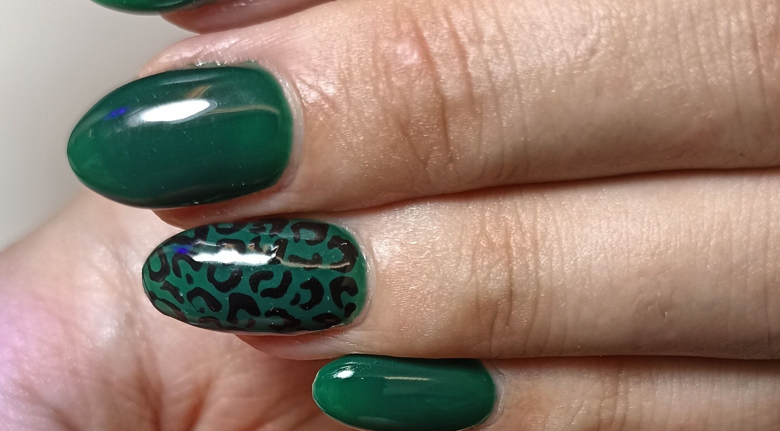 Stylish green leopard print nails at Tranquility C Salon, Krugersdorp, Gauteng, ZA.