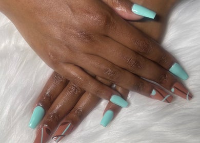 Stylish mint and nude nail art from Trending UK Nails, London, England, GB on a plush white background.