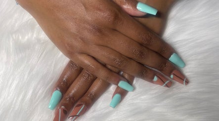 Stylish mint and nude nail art from Trending UK Nails, London, England, GB on a plush white background.