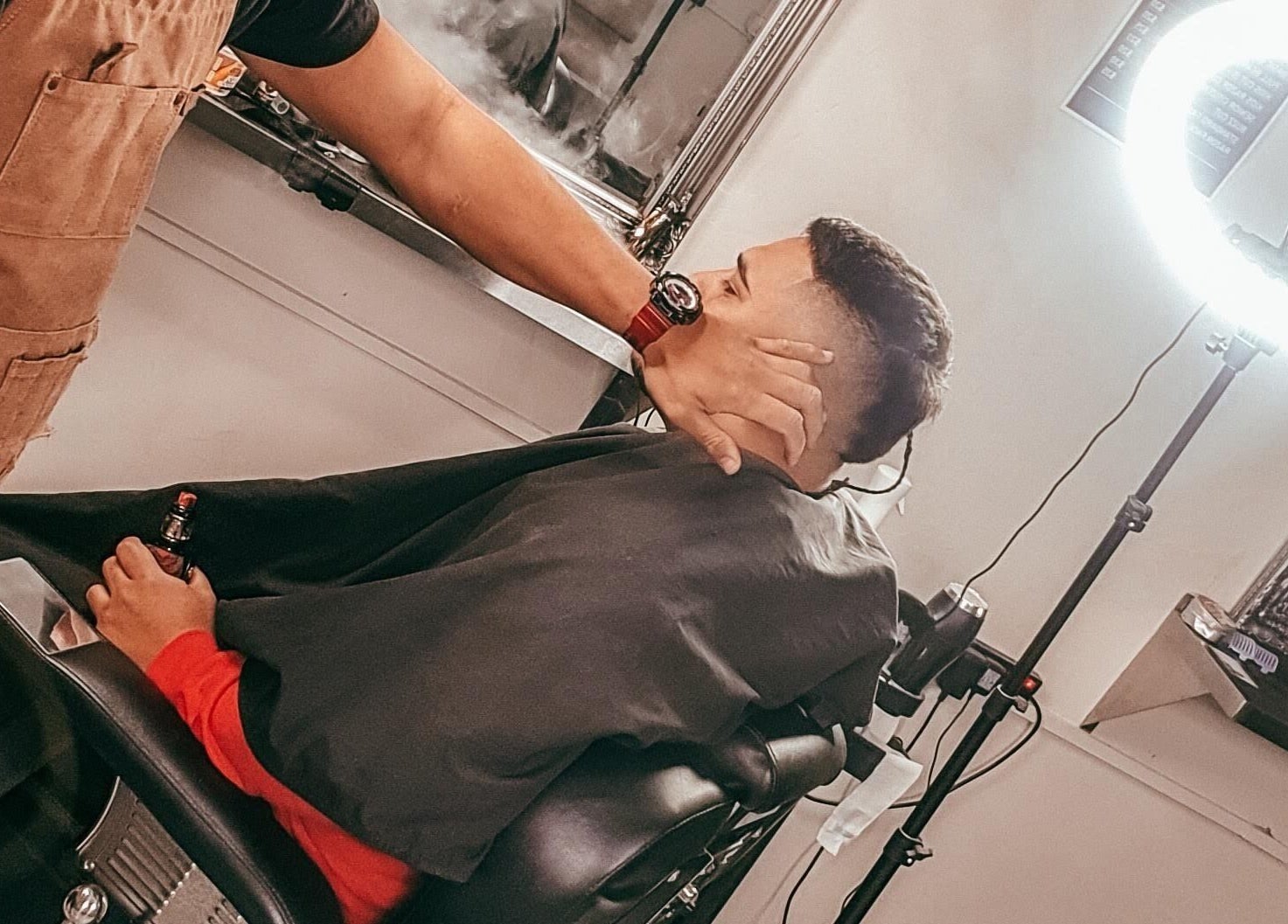 Barber crafting a fresh haircut at Tapslab, Tokoroa, Waikato, NZ under professional lighting.