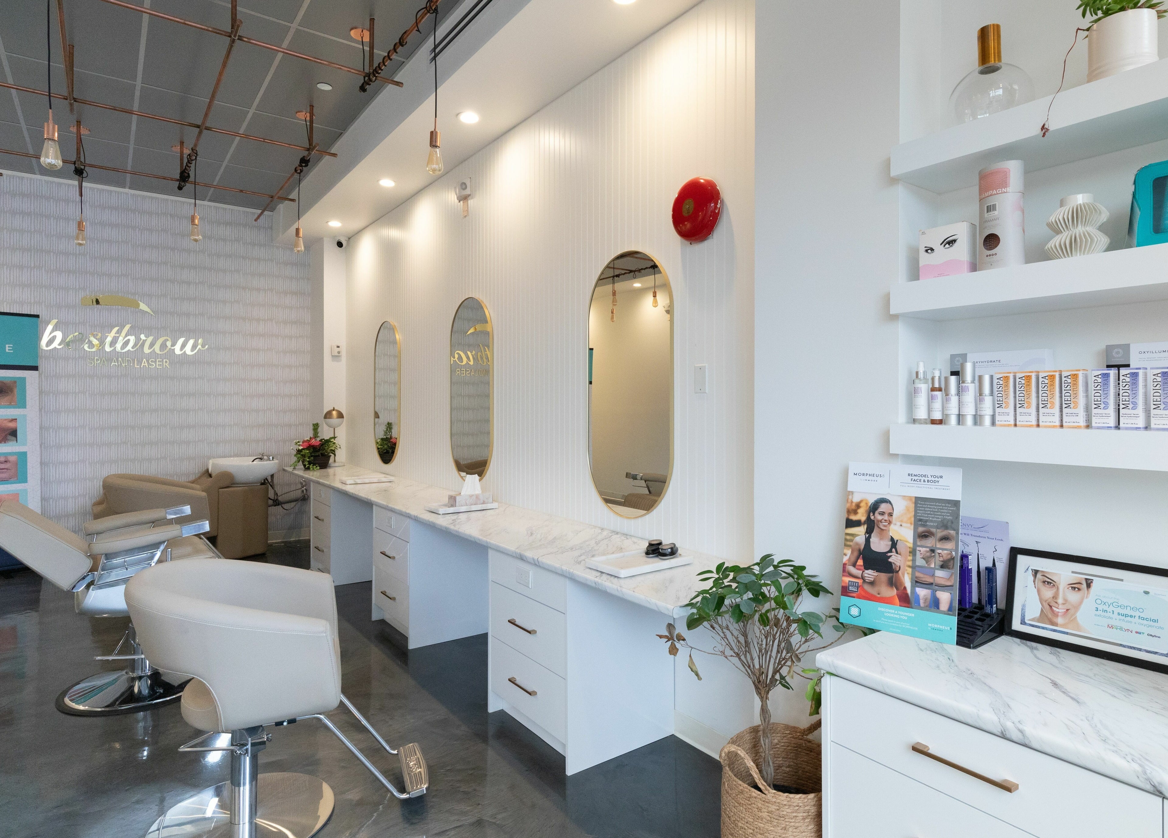 Modern salon interior of Best Brow Spa in Vancouver, British Columbia, CA with mirrors and sleek chairs.