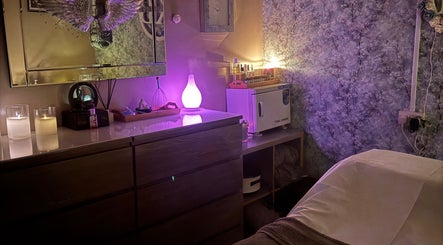 Peaceful treatment room at Krystle Beauty, Swalwell, England, GB with soft lighting and calming decor.