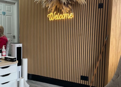 Warm welcome sign in Krystle Beauty, Swalwell, England, GB with sleek interior design.