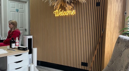 Warm welcome sign in Krystle Beauty, Swalwell, England, GB with sleek interior design.