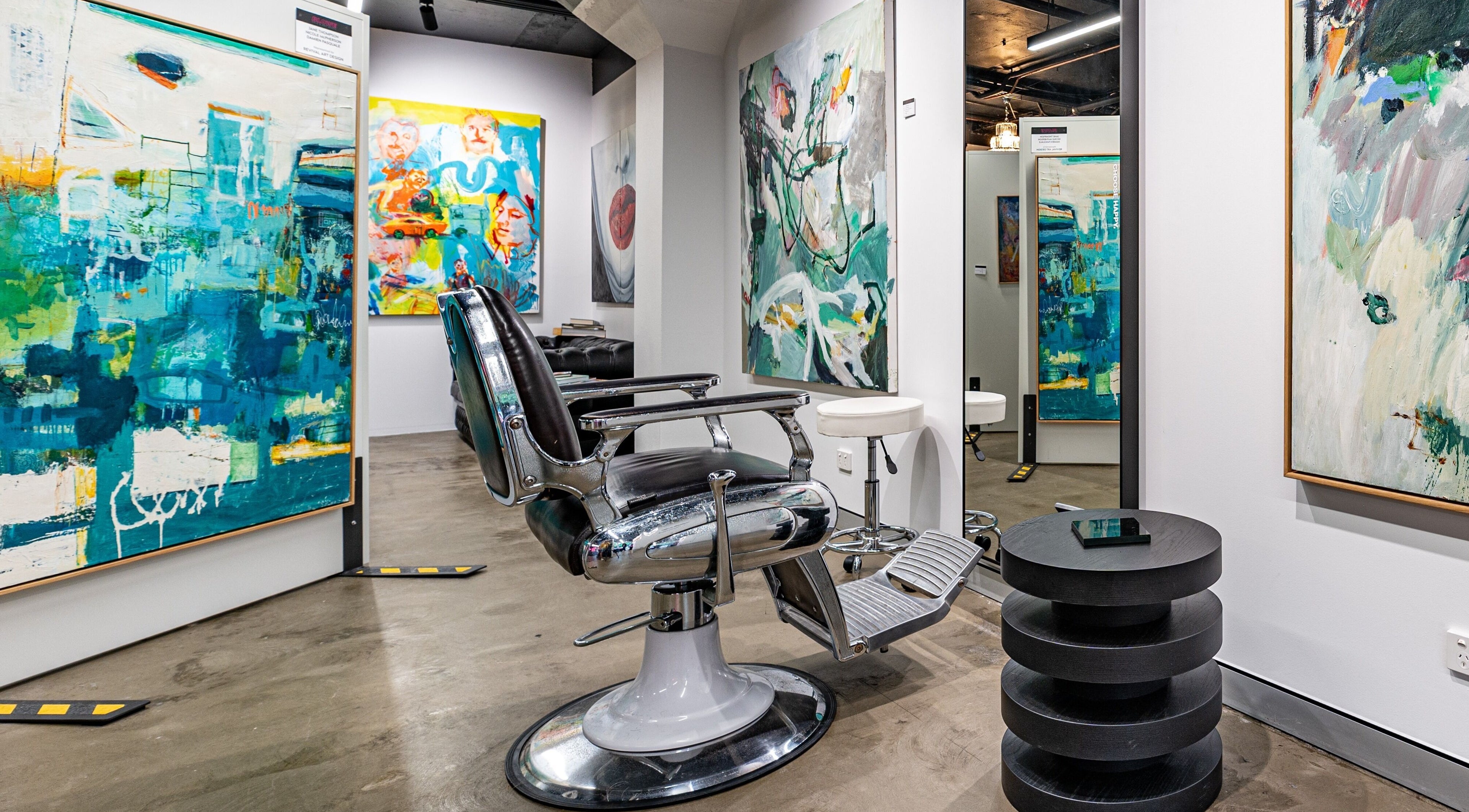 Chic salon chair with vibrant art at Blowe Hair Art Space, Brisbane, QLD, AU. A unique and stylish experience.