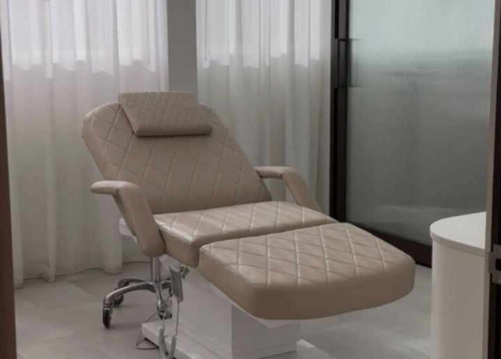 Luxurious treatment chair at EMBER Aesthetics, Mosman, New South Wales, AU, highlighting comfort and elegance.
