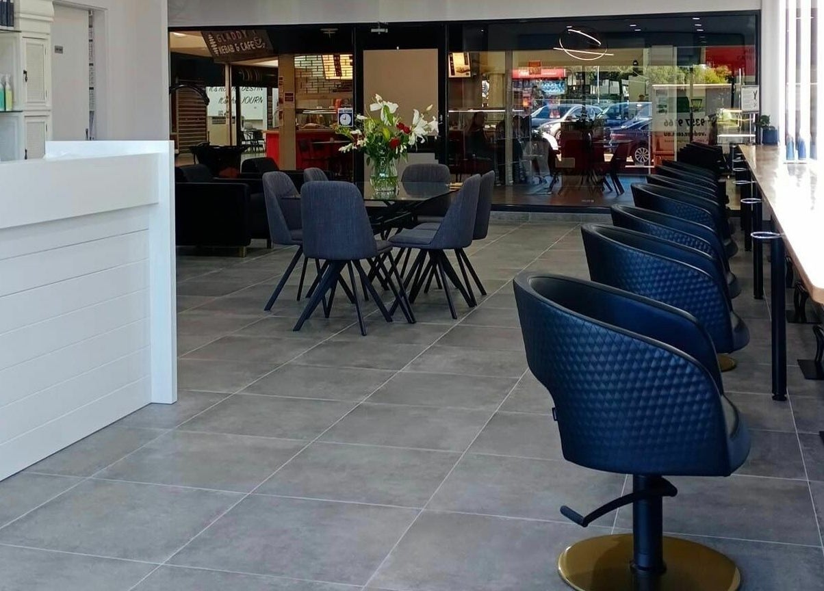 Modern seating and chic decor at Prestige Hair by Selma in Melbourne, Victoria, AU.