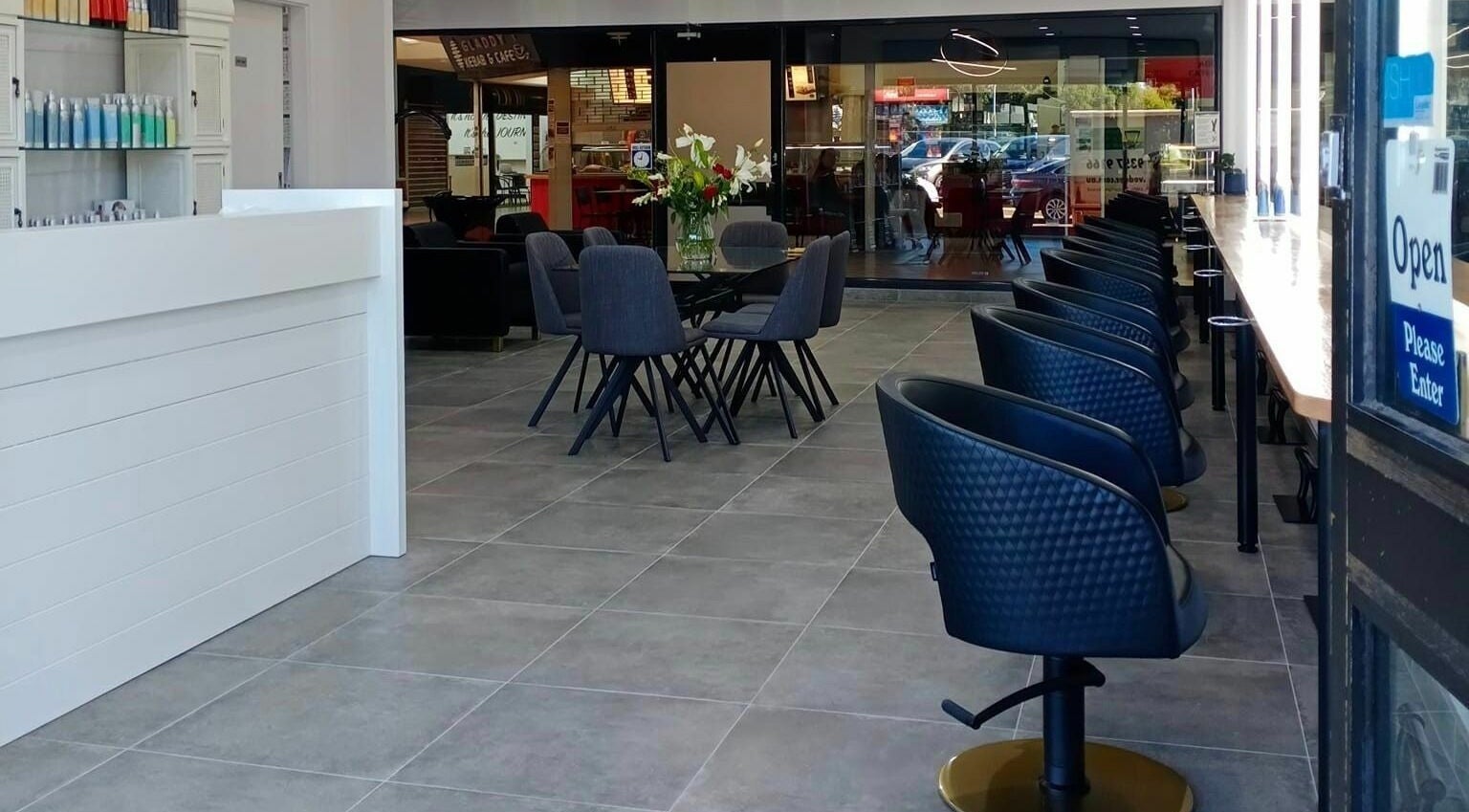 Modern seating and chic decor at Prestige Hair by Selma in Melbourne, Victoria, AU.