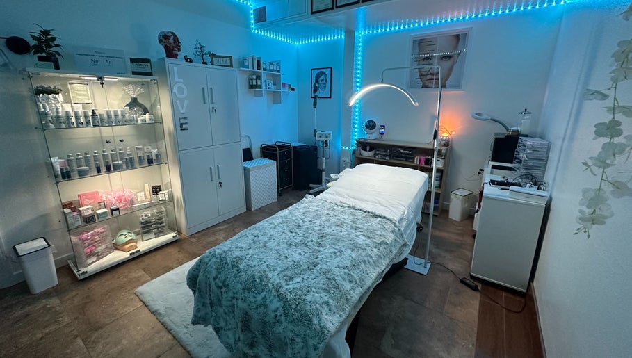 Relaxing treatment room at Refreshed Looks Aesthetics, Tucson, Arizona, US, with calming decor and skincare products.