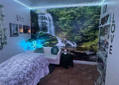 Relaxing spa room with waterfall mural at Refreshed Looks Aesthetics, Tucson, Arizona, US.