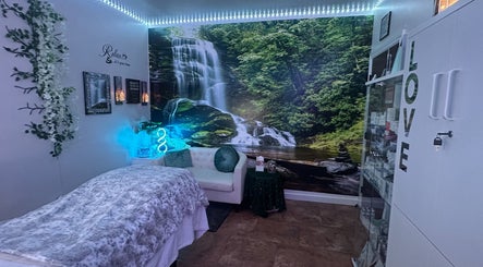 Relaxing spa room with waterfall mural at Refreshed Looks Aesthetics, Tucson, Arizona, US.