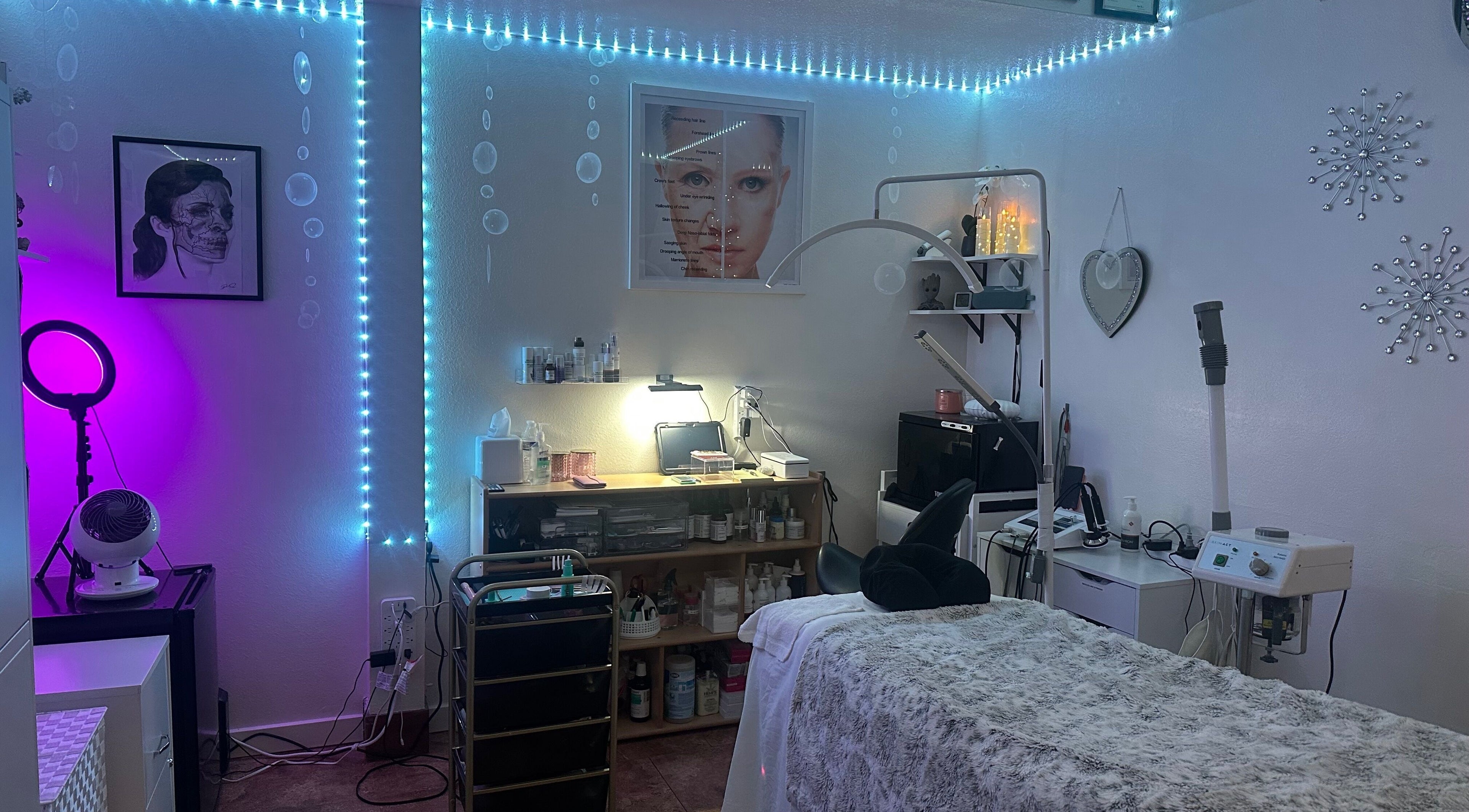 Tranquil treatment room at Refreshed Looks Aesthetics, Tucson, Arizona, US, featuring ambient lighting and cozy decor.