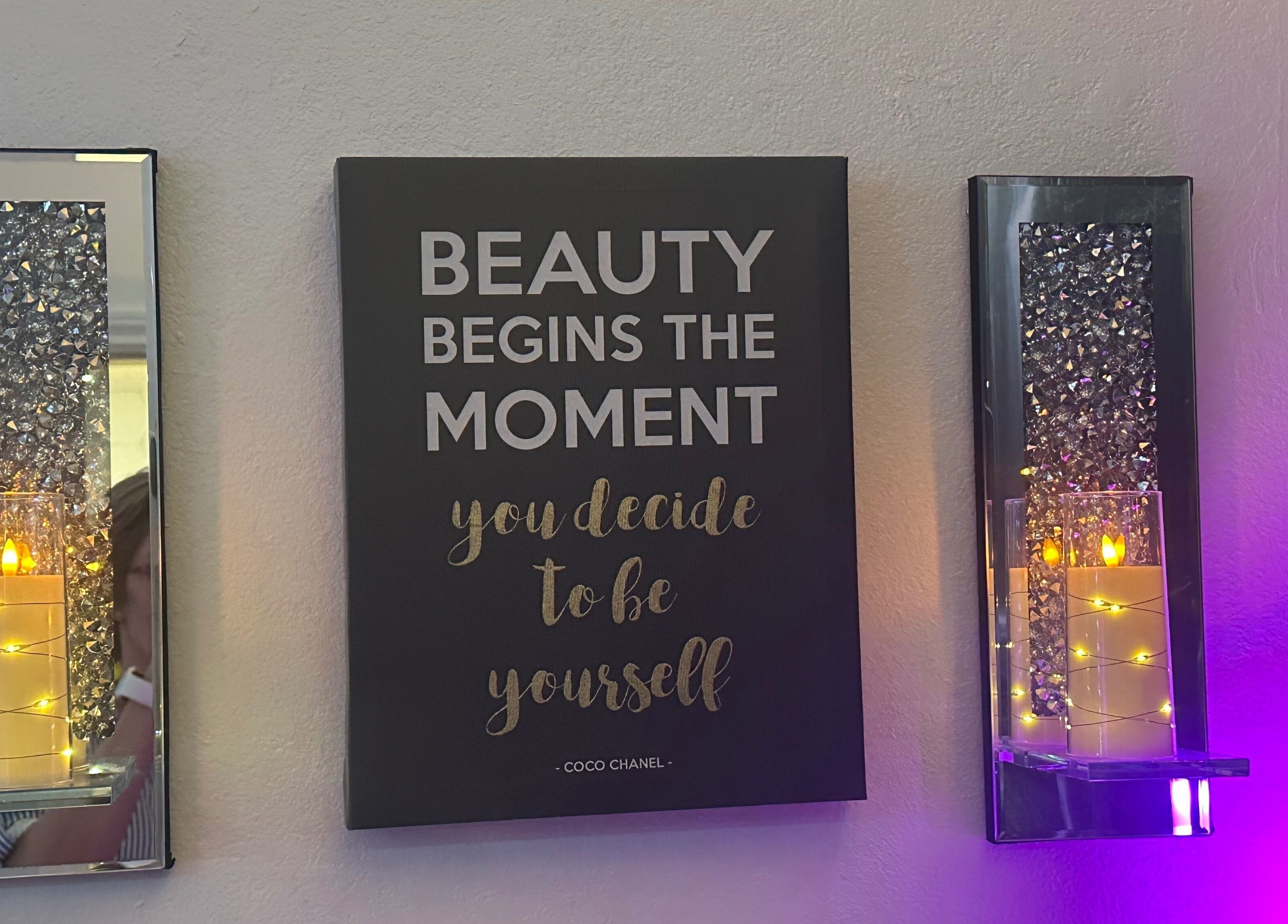 Chic wall decor with inspirational quote at Refreshed Looks Aesthetics, Tucson, Arizona, US.