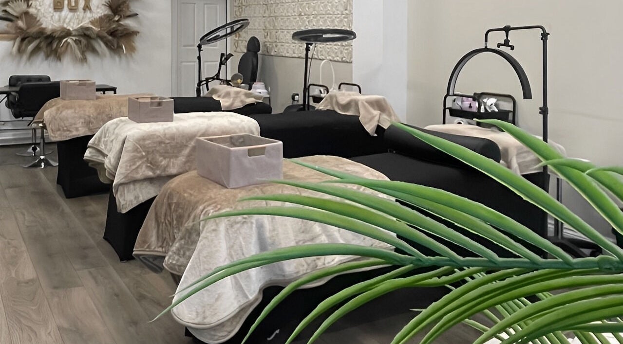 Luxurious wellness room at Beauty Box, Gillingham, England, GB, featuring multiple spa beds and modern decor.