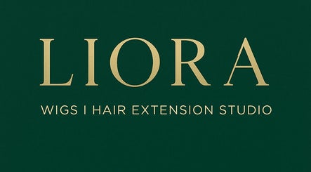 Elegant Liora | Wigs & Hair Extension Studio signage in Lincoln, England, GB, in gold lettering on green background.