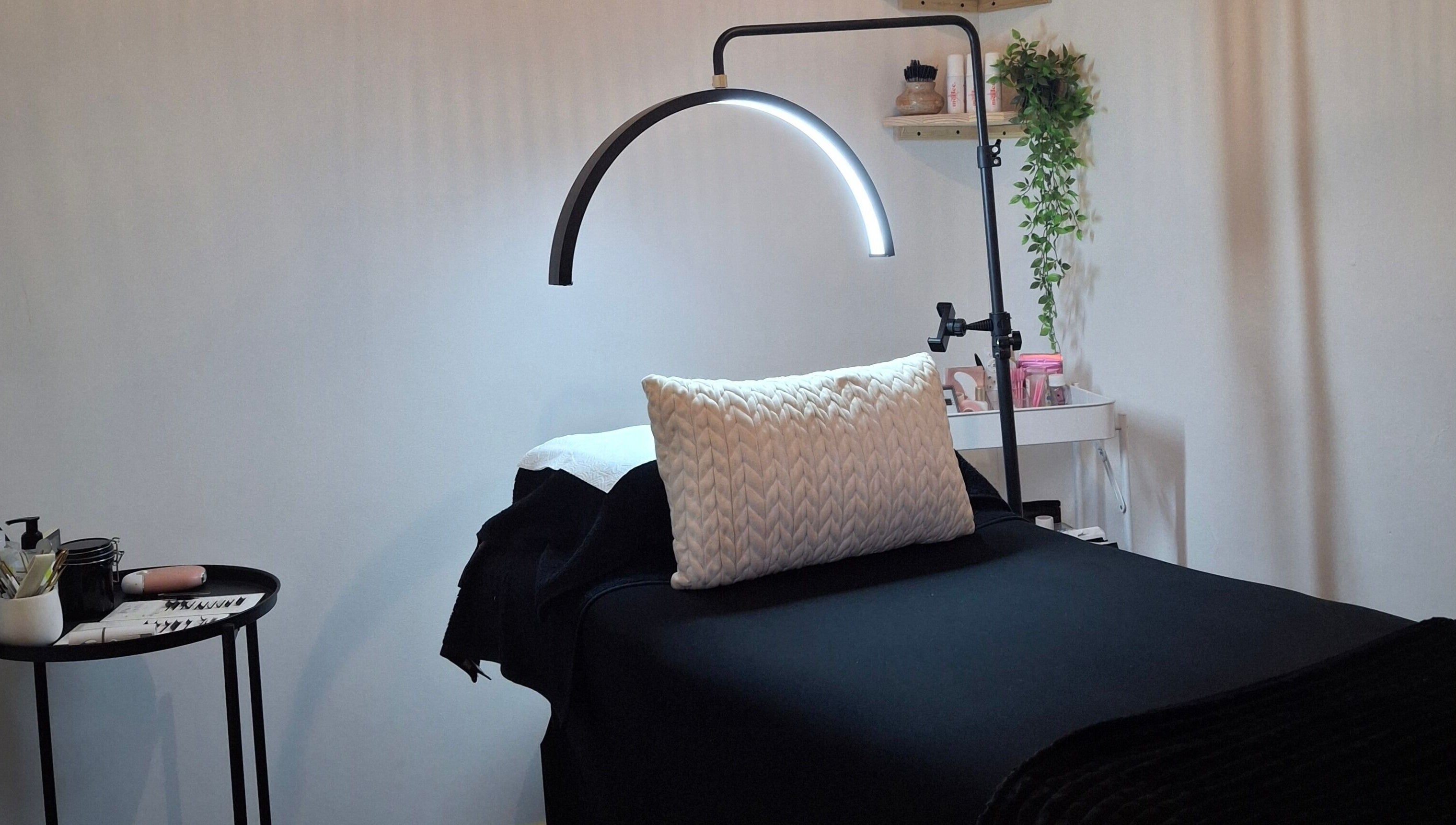 Cozy lash treatment bed at Lily's Lashes in Gillitts, Kwazulu-Natal, ZA with ambient lighting.