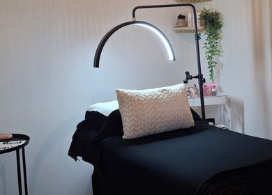 Cozy lash treatment bed at Lily's Lashes in Gillitts, Kwazulu-Natal, ZA with ambient lighting.