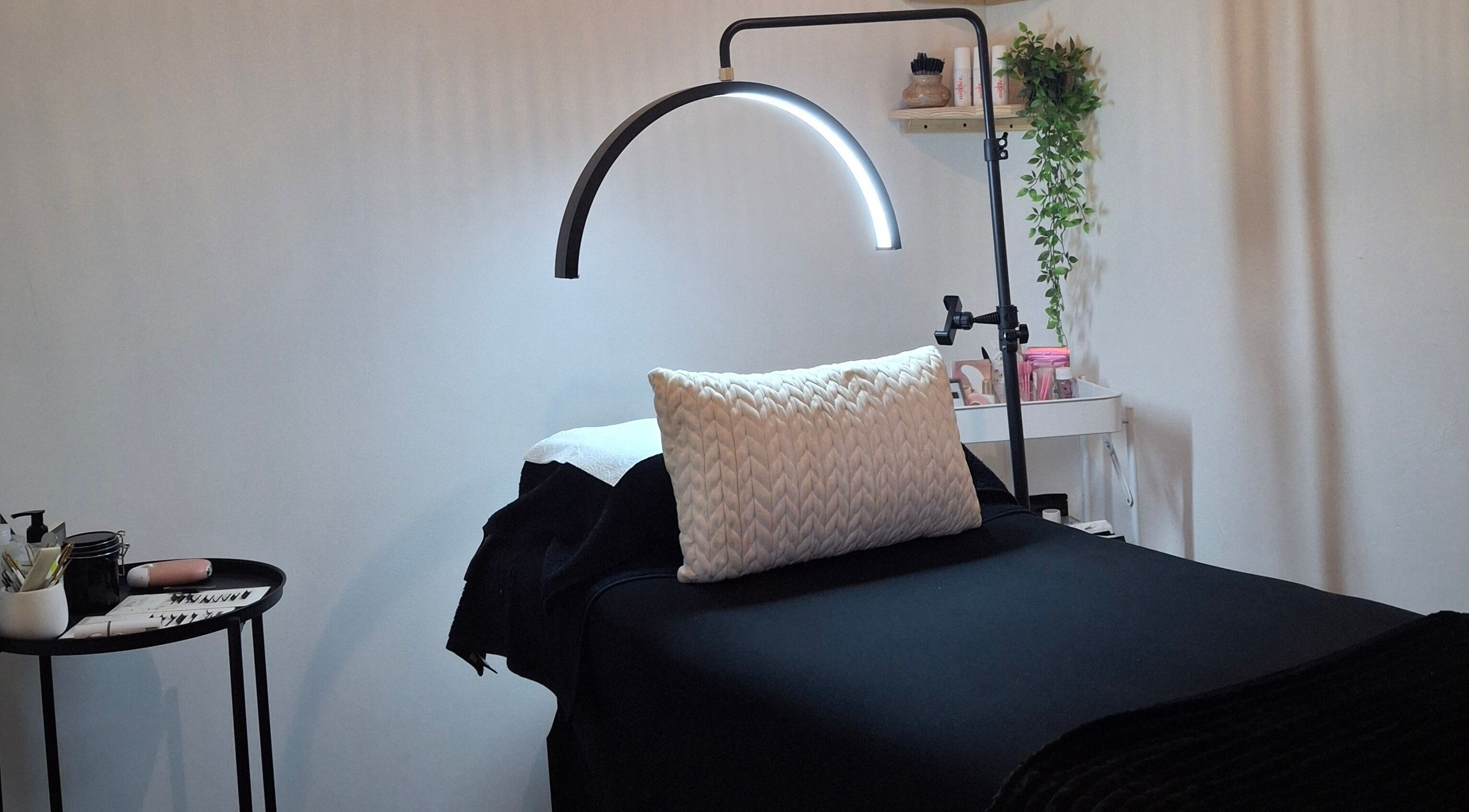 Cozy lash treatment bed at Lily's Lashes in Gillitts, Kwazulu-Natal, ZA with ambient lighting.