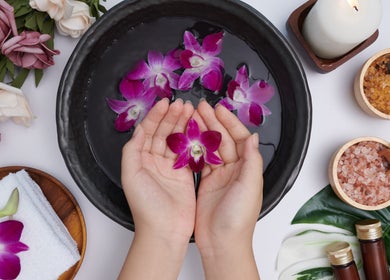 Serene orchid petals in water at Daily Therapy Spa (In-Home Massage), Dubai, Dubai, AE for relaxation.