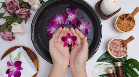 Serene orchid petals in water at Daily Therapy Spa (In-Home Massage), Dubai, Dubai, AE for relaxation.