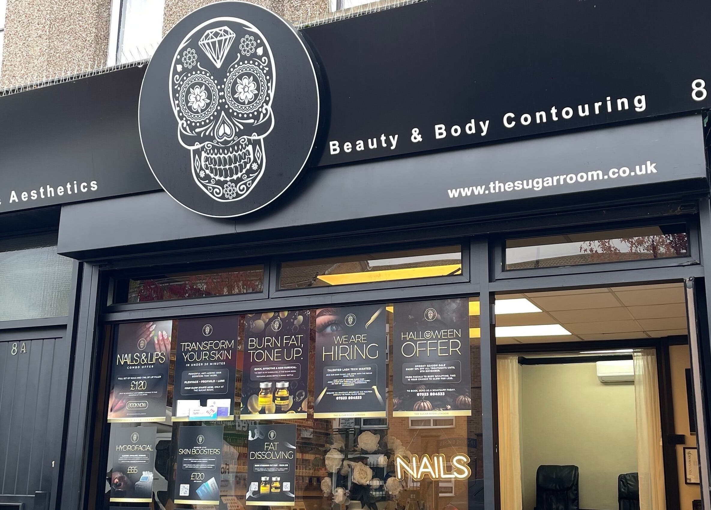 Mannor Park Nails storefront with iconic skull logo, London, England, GB.