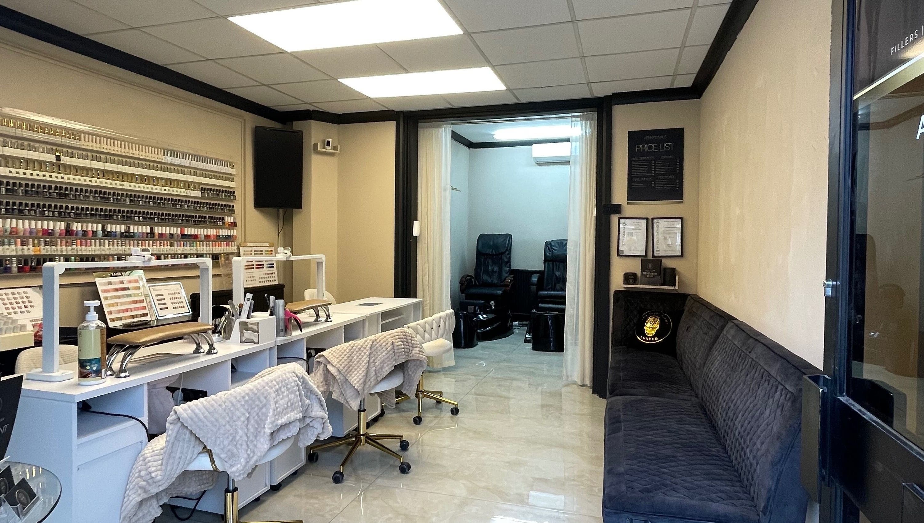 Interior of Mannor Park Nails in London, England, GB, showcasing manicure stations and seating area.