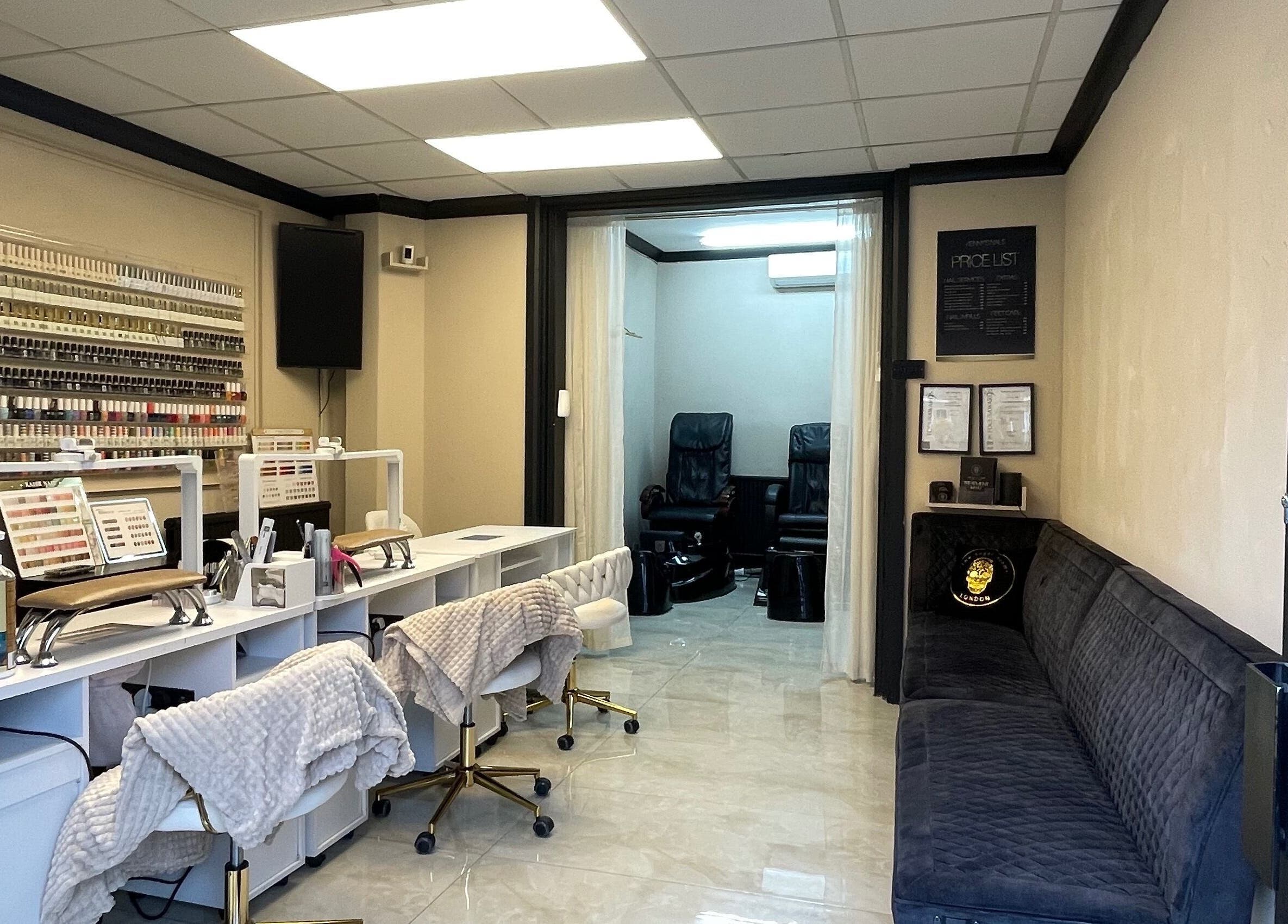 Interior of Mannor Park Nails in London, England, GB, showcasing manicure stations and seating area.