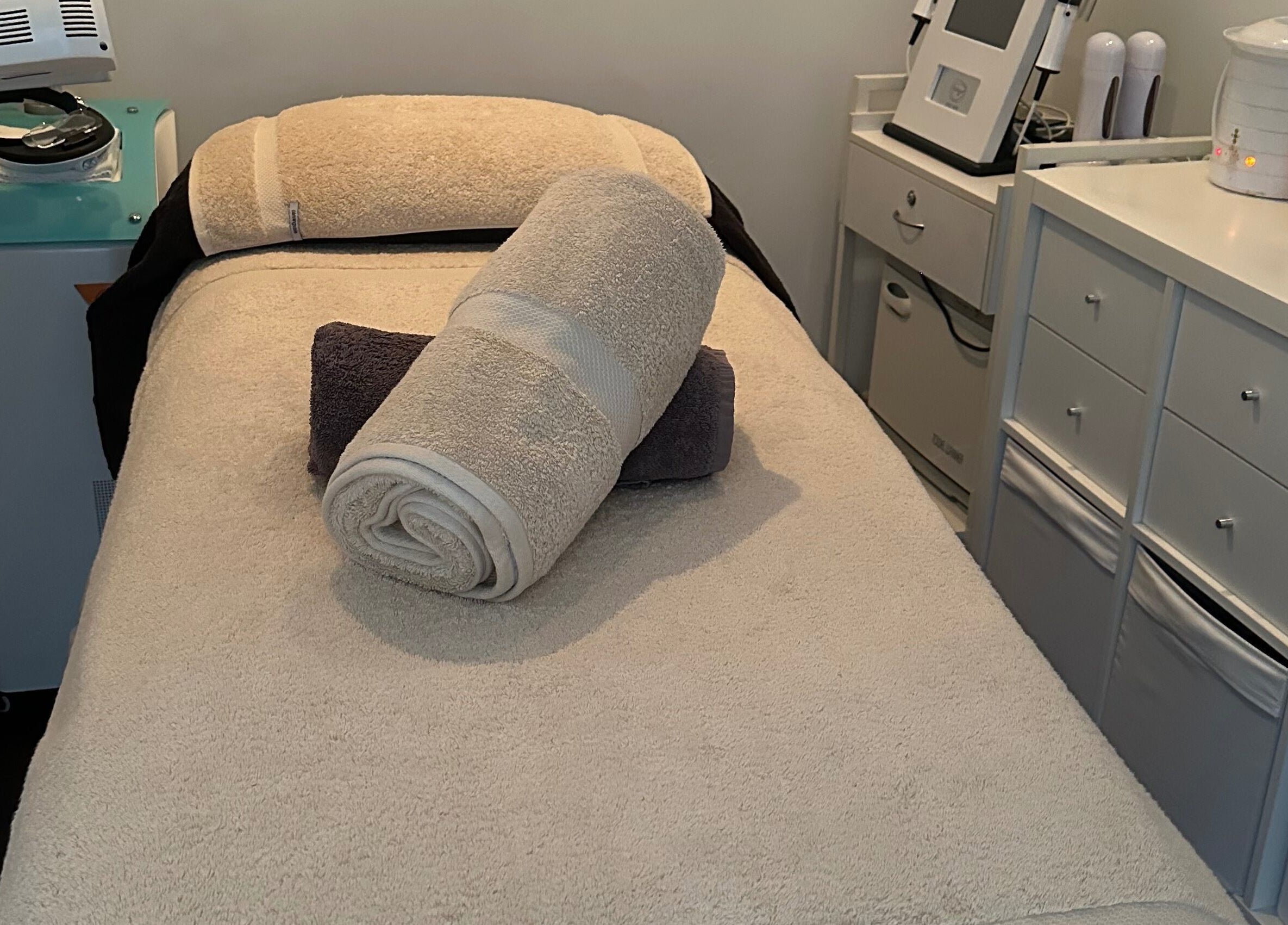 Cozy treatment room at Skinplus, Pymble, New South Wales, AU, showcasing a plush massage table.