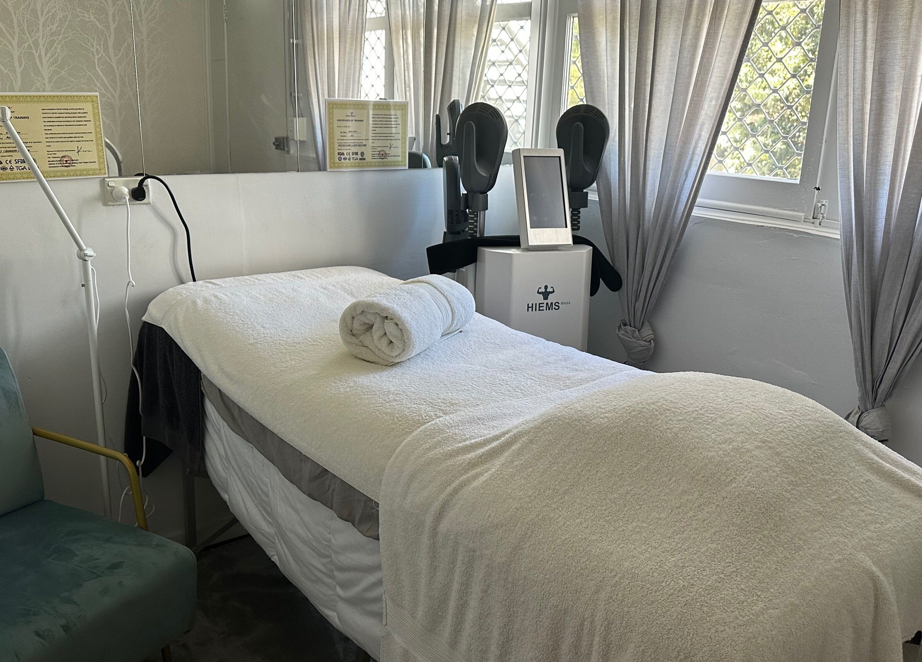 Serene treatment room at Skinplus, Pymble, New South Wales, AU, featuring a cozy massage bed and calming decor.