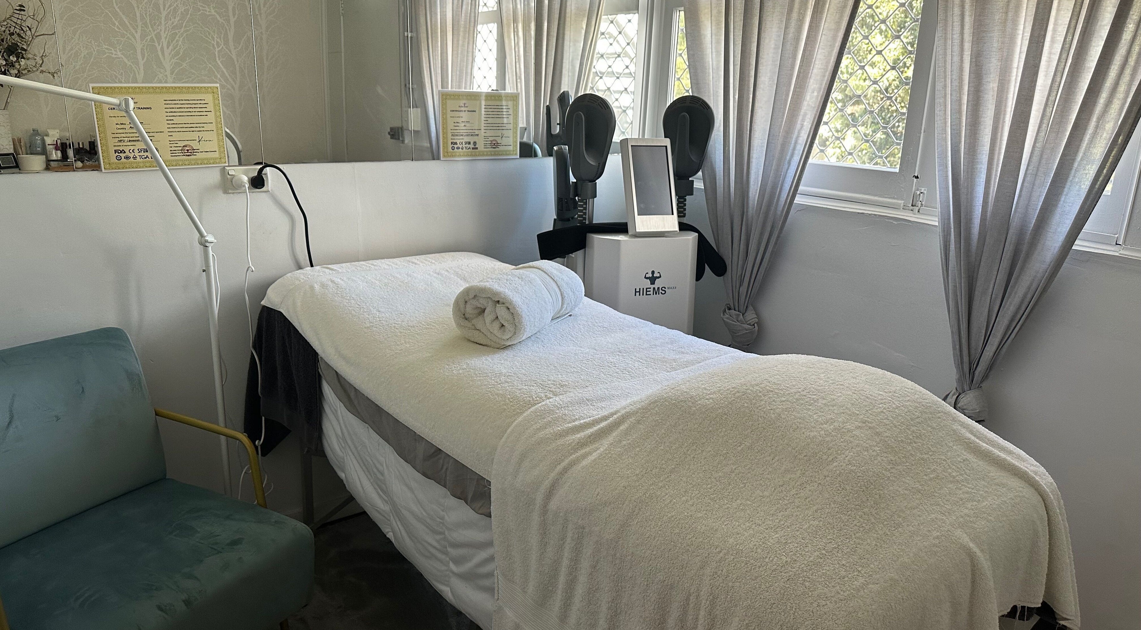 Serene treatment room at Skinplus, Pymble, New South Wales, AU, featuring a cozy massage bed and calming decor.