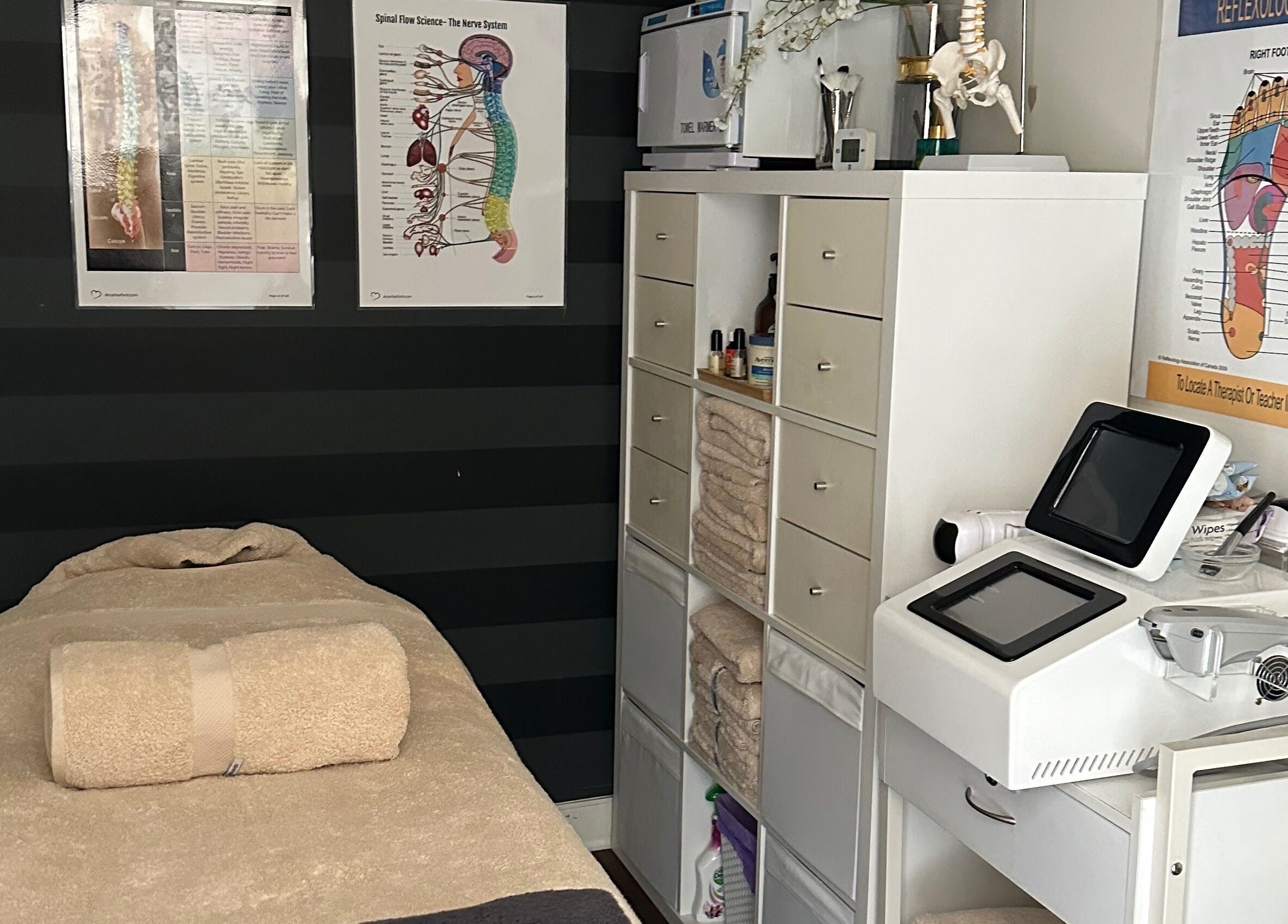 A tranquil massage room at Skinplus, Pymble, New South Wales, AU, featuring a cozy treatment bed and wellness equipment.